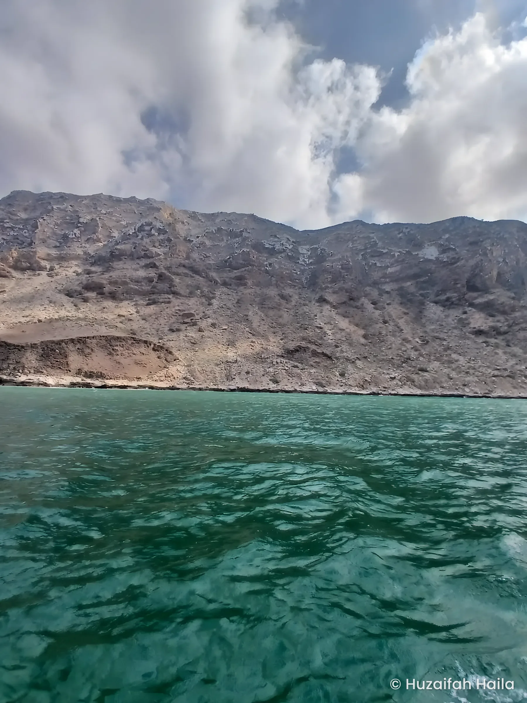 Mountains above turquoise sea, the Bari region coast, Somalia