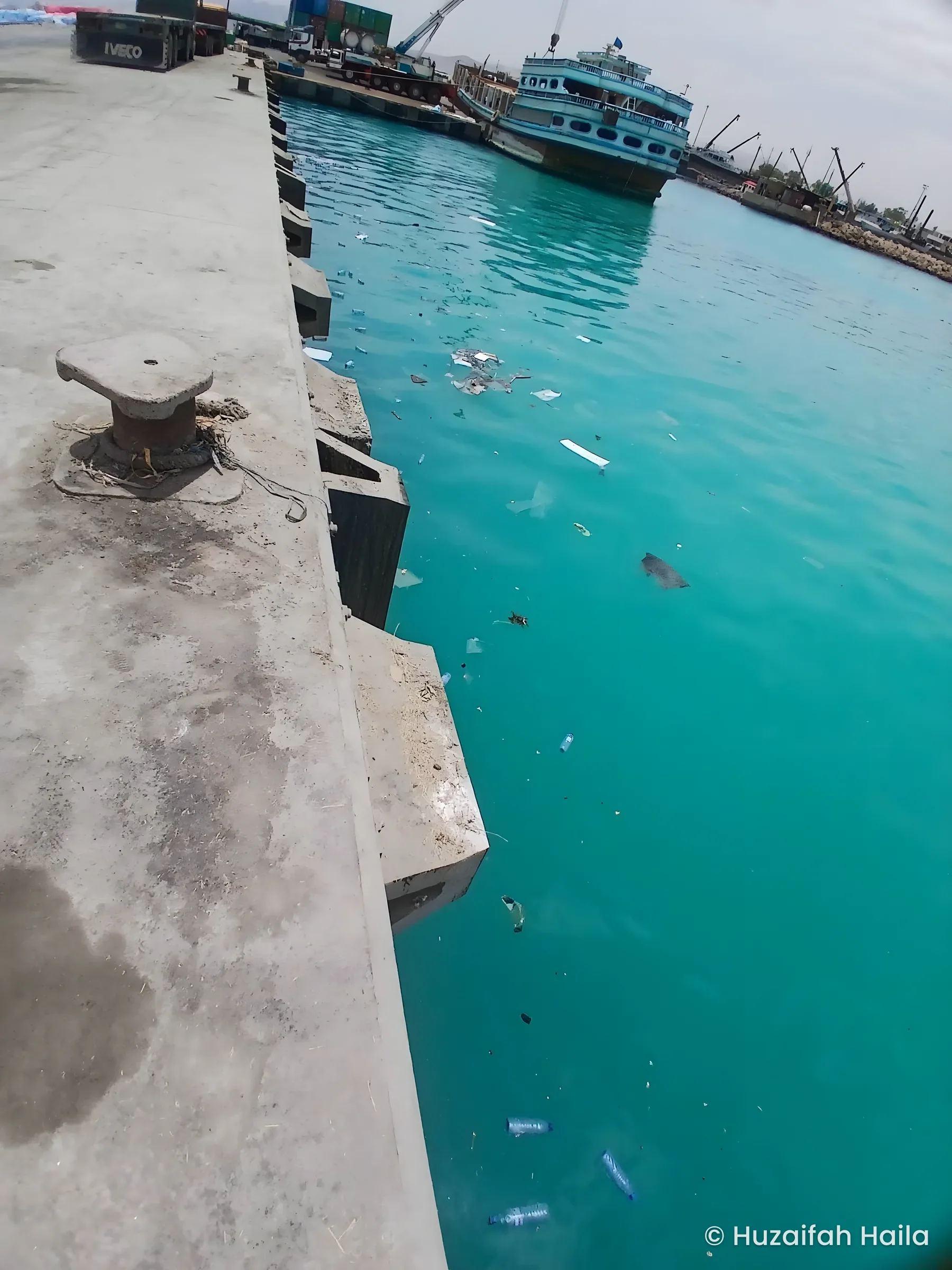 Harbour wall and turquoise water, Bosaso Port, Somalia