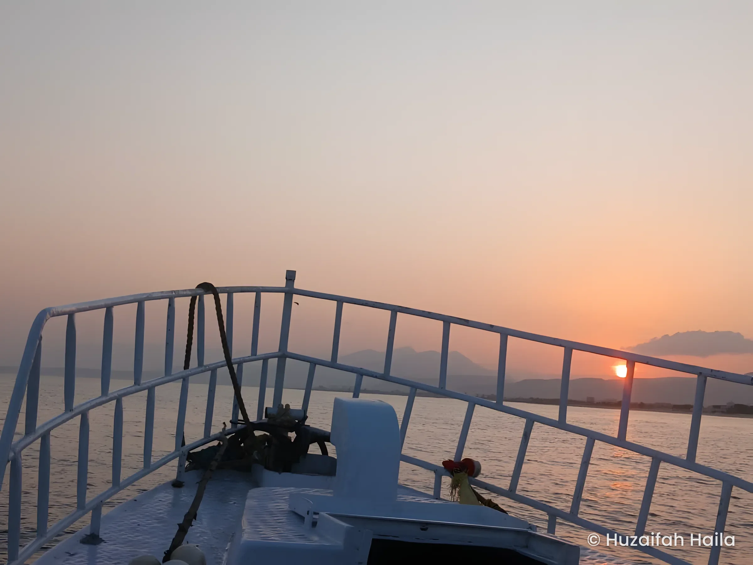The bow of the Horaad boat at sunset