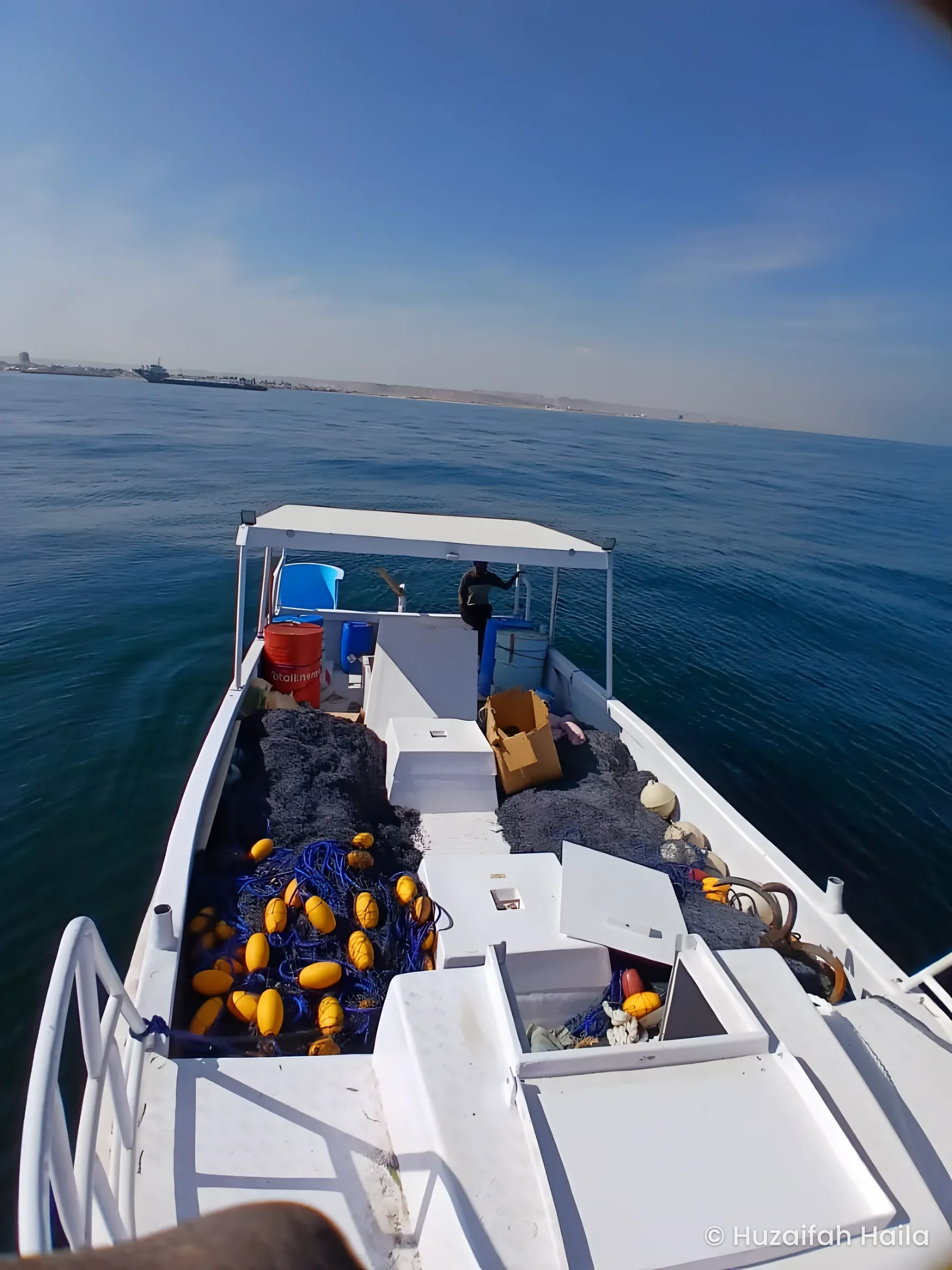 The deck of the Horaad boat with nets, at sea